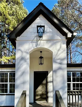 a front view of a house with large windows