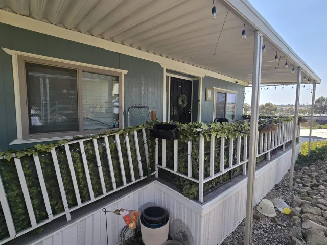 a view of a porch with wooden floor
