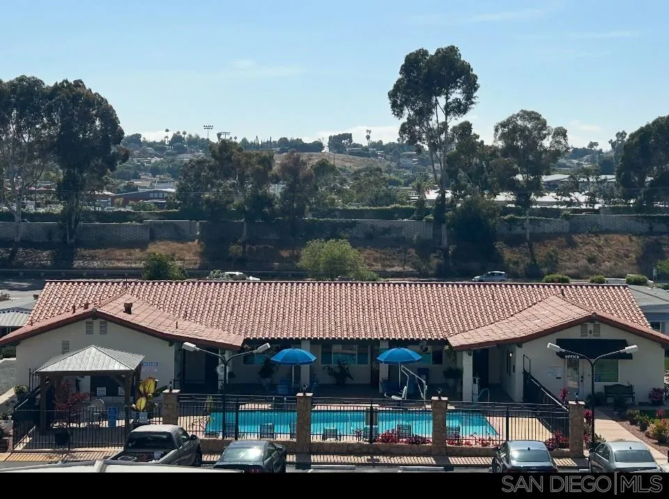 1815 Sweetwater Road, Unit SPC 120 Spring Valley, CA 91977 - Photo 27 of 49 a front view of a house with garden and patio