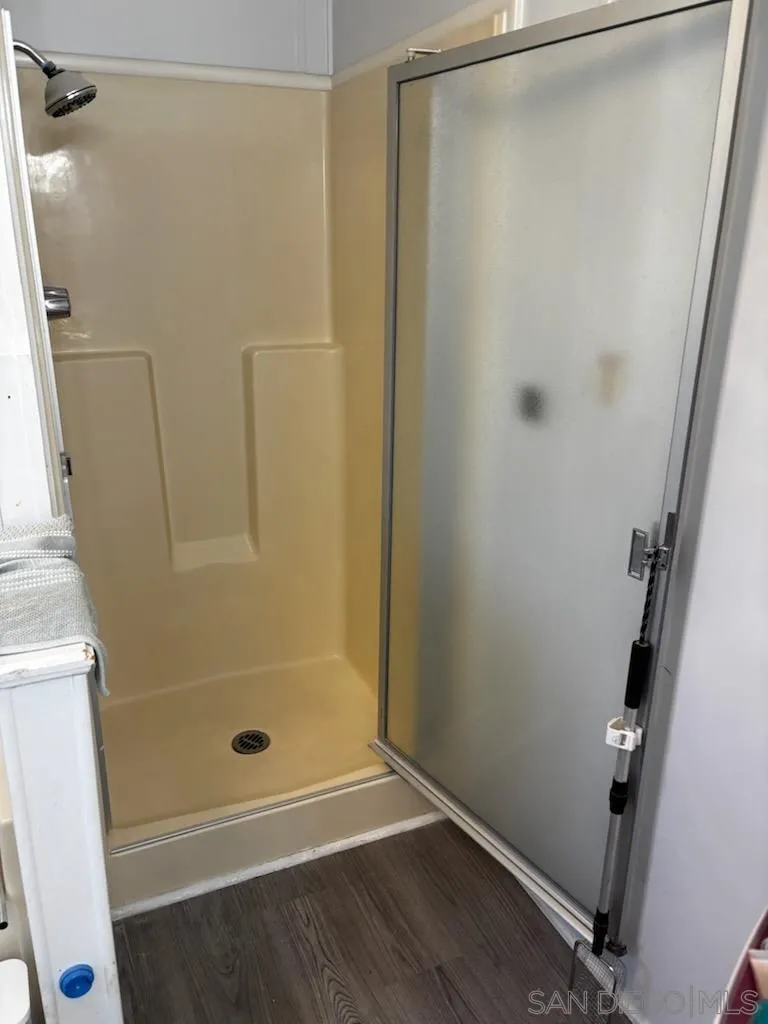 1815 Sweetwater Road, Unit SPC 120 Spring Valley, CA 91977 - Photo 38 of 49 a bathroom with a glass shower door