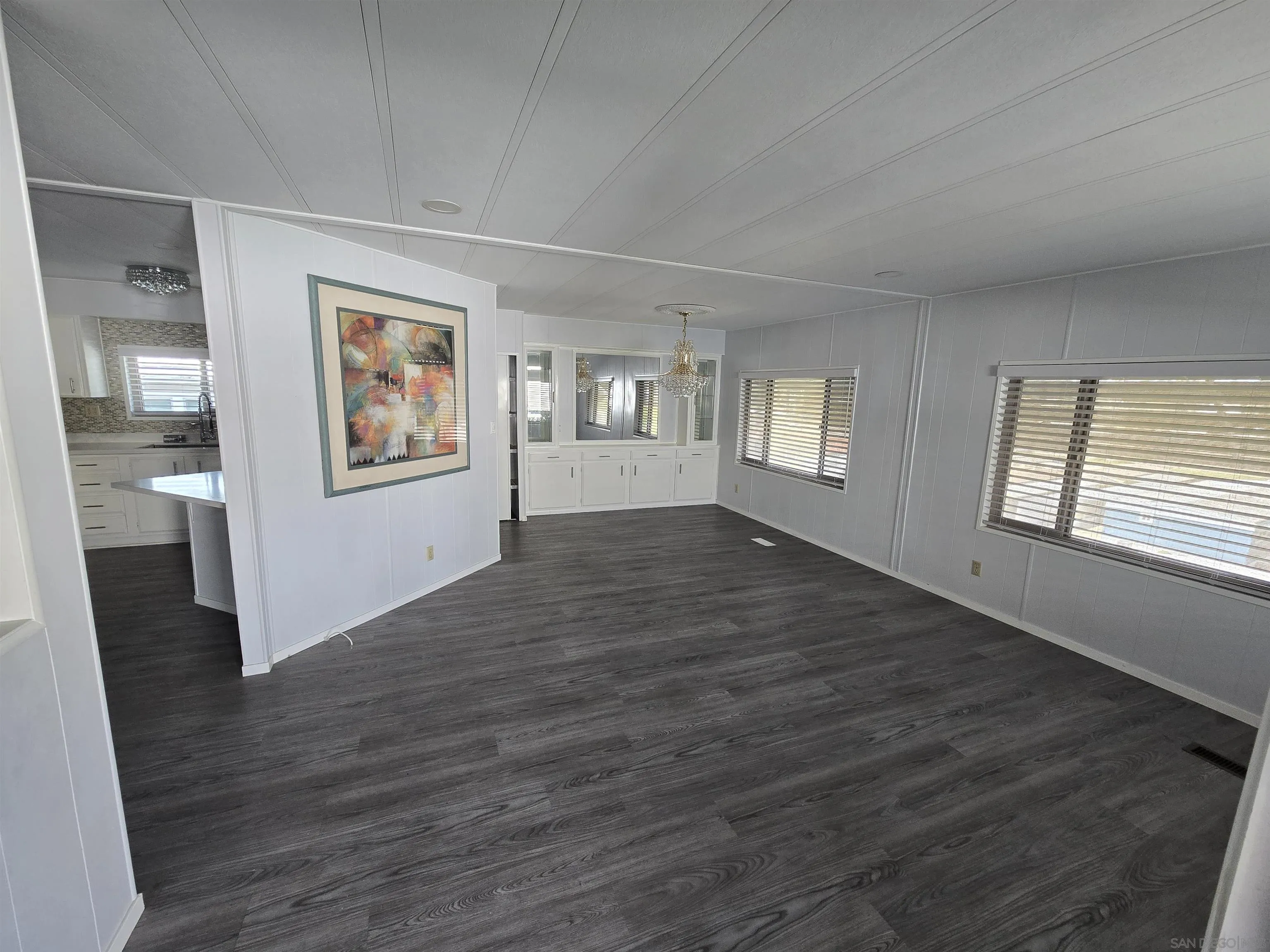 1815 Sweetwater Road, Unit SPC 120 Spring Valley, CA 91977 - Photo 4 of 49 a view of empty room with wooden floor and fan