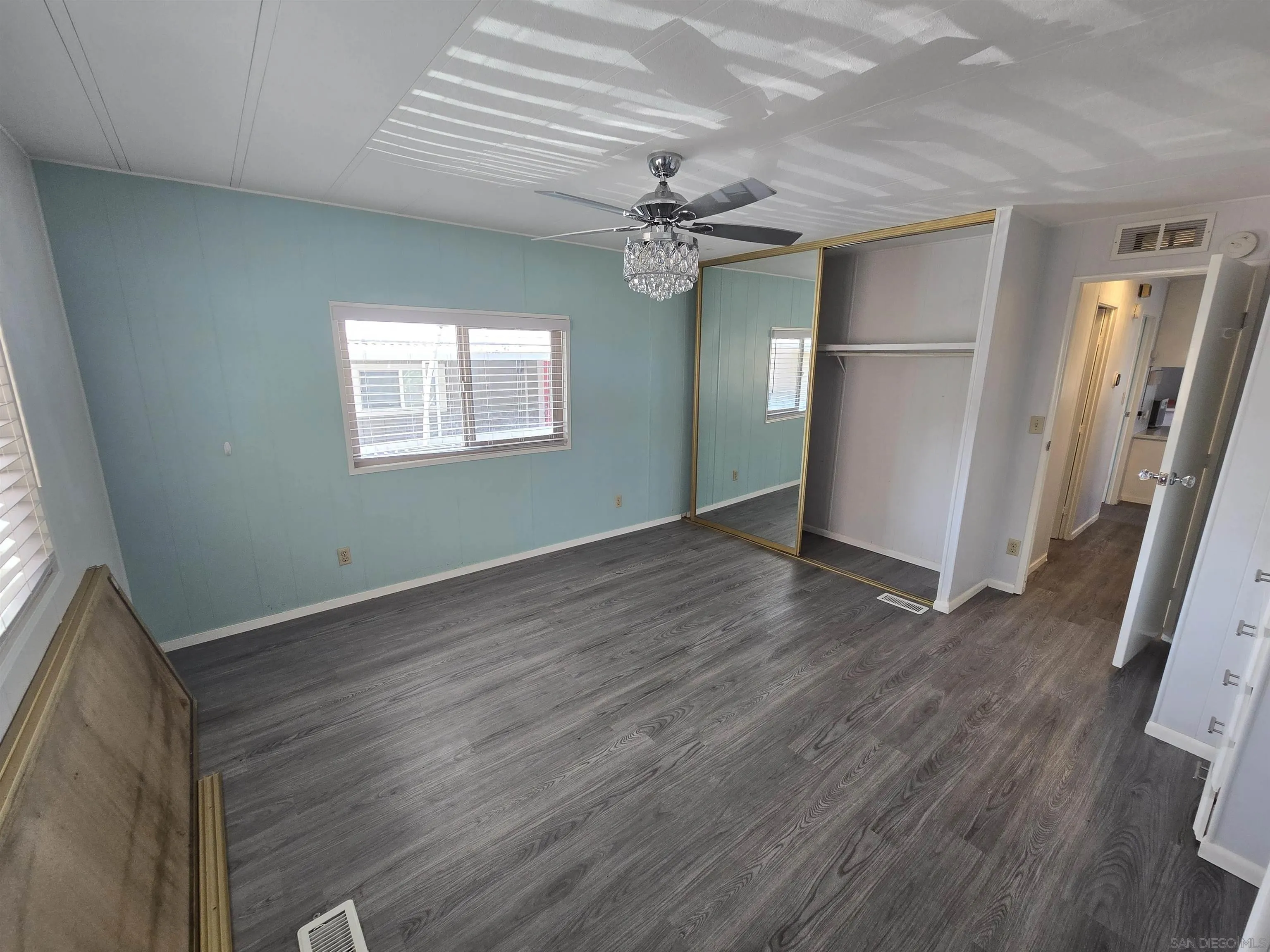 1815 Sweetwater Road, Unit SPC 120 Spring Valley, CA 91977 - Photo 9 of 49 wooden floor in an empty room with a window