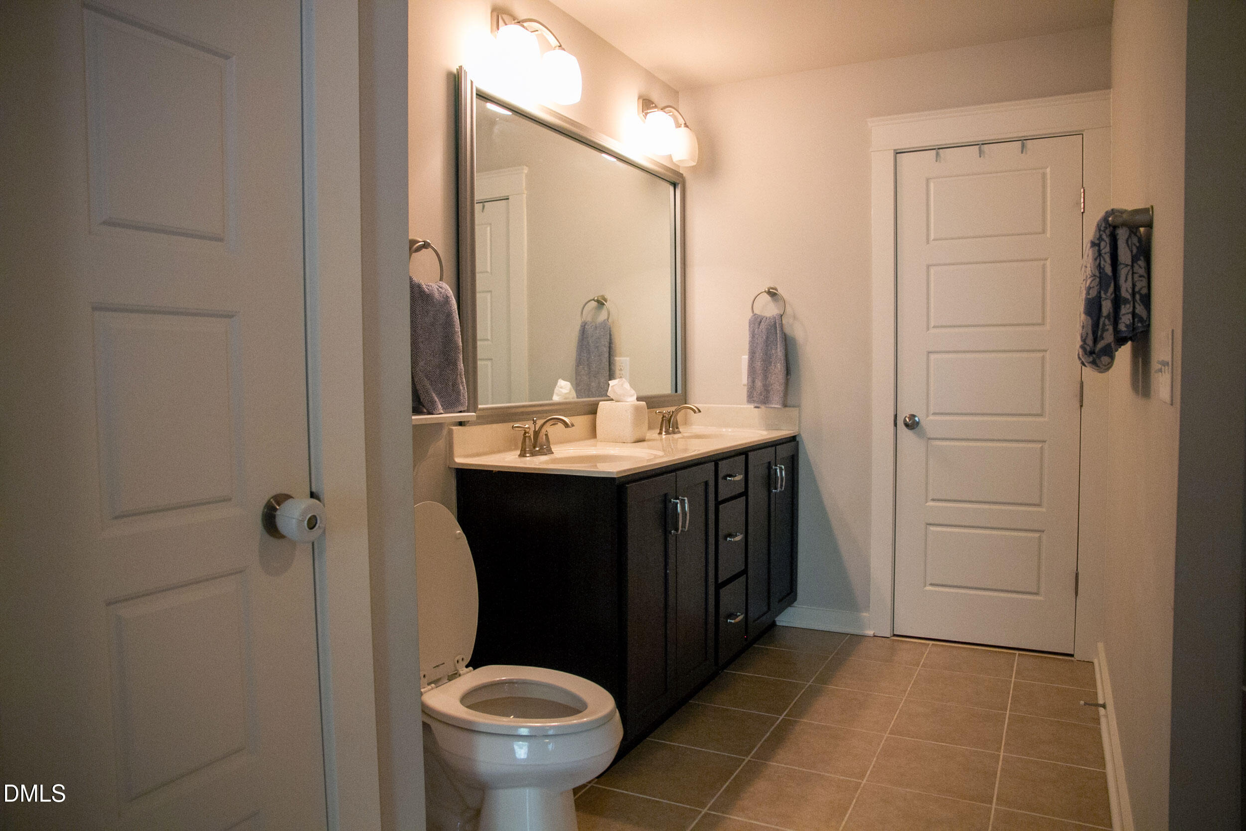 7802 Allscott Way Raleigh, NC 27612 - Photo 17 of 25 a bathroom with a sink a toilet and shower