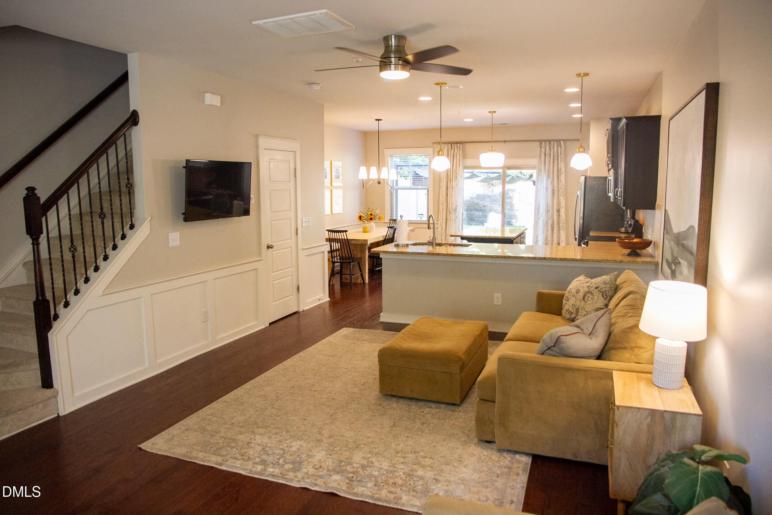 7802 Allscott Way Raleigh, NC 27612 - Photo 5 of 25 a living room with furniture and a large window