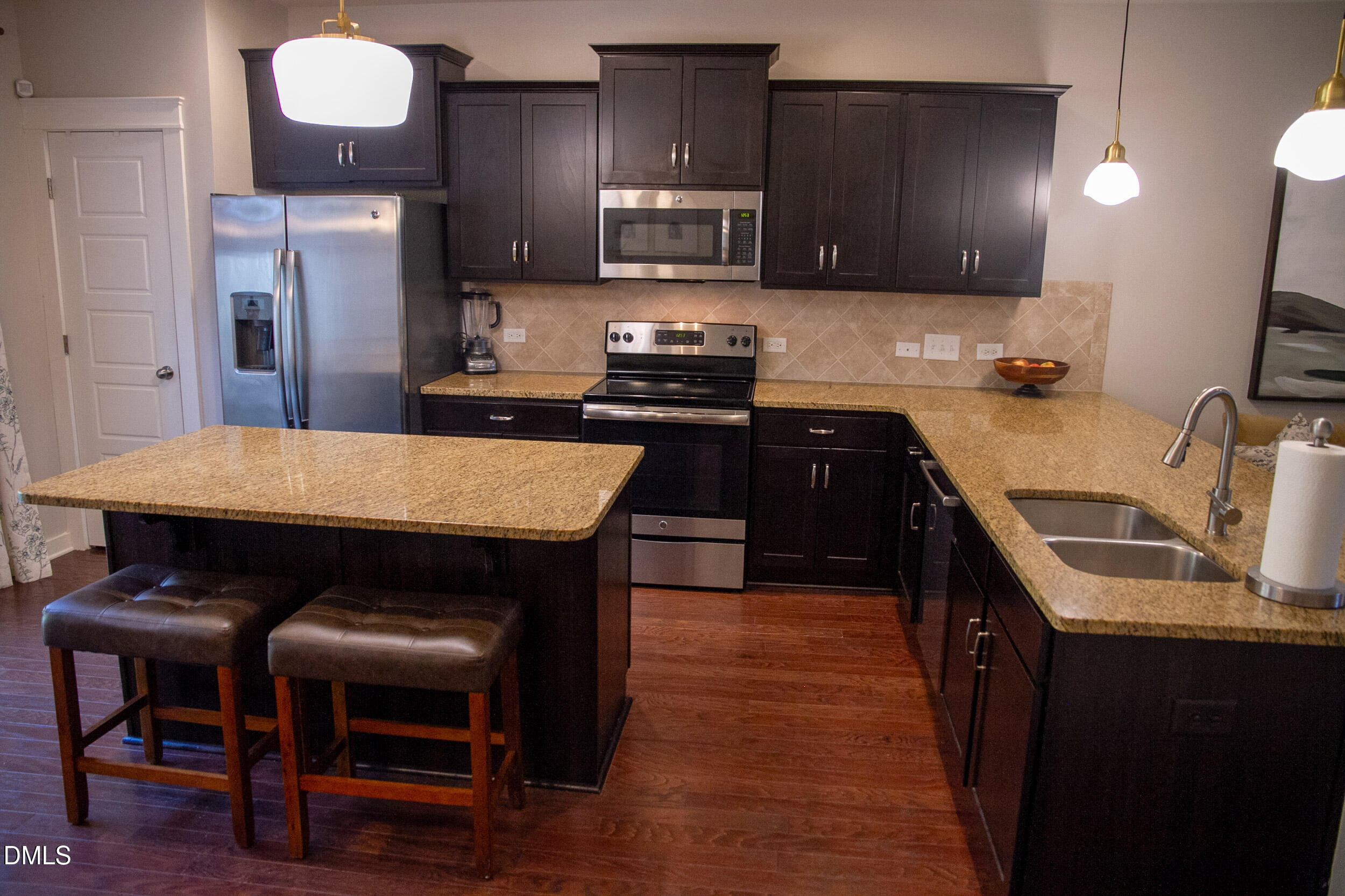 7802 Allscott Way Raleigh, NC 27612 - Photo 8 of 25 a kitchen with stainless steel appliances granite countertop a stove refrigerator sink and cabinets