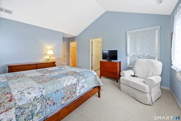 a bedroom with bed and window