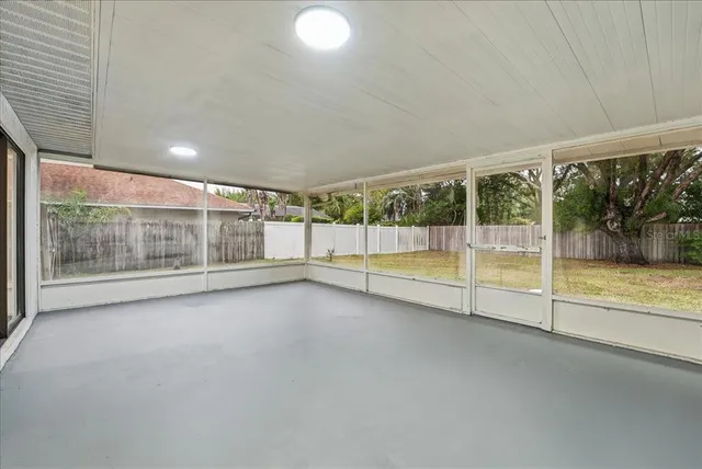 a view of an empty room with a fireplace