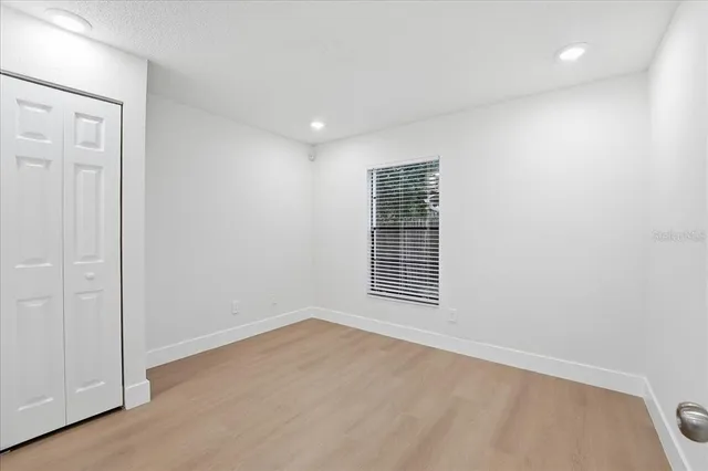 a view of an empty room with a window