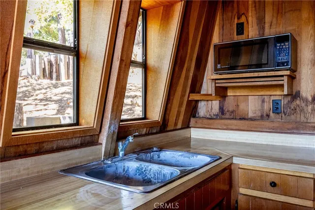 a kitchen with sink and window