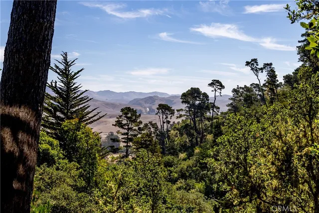 a view of a house with a small deck
