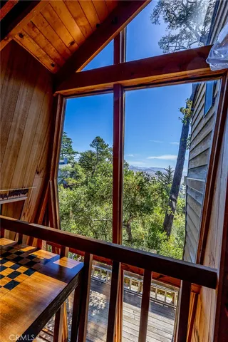 a view of a room with furniture and a window