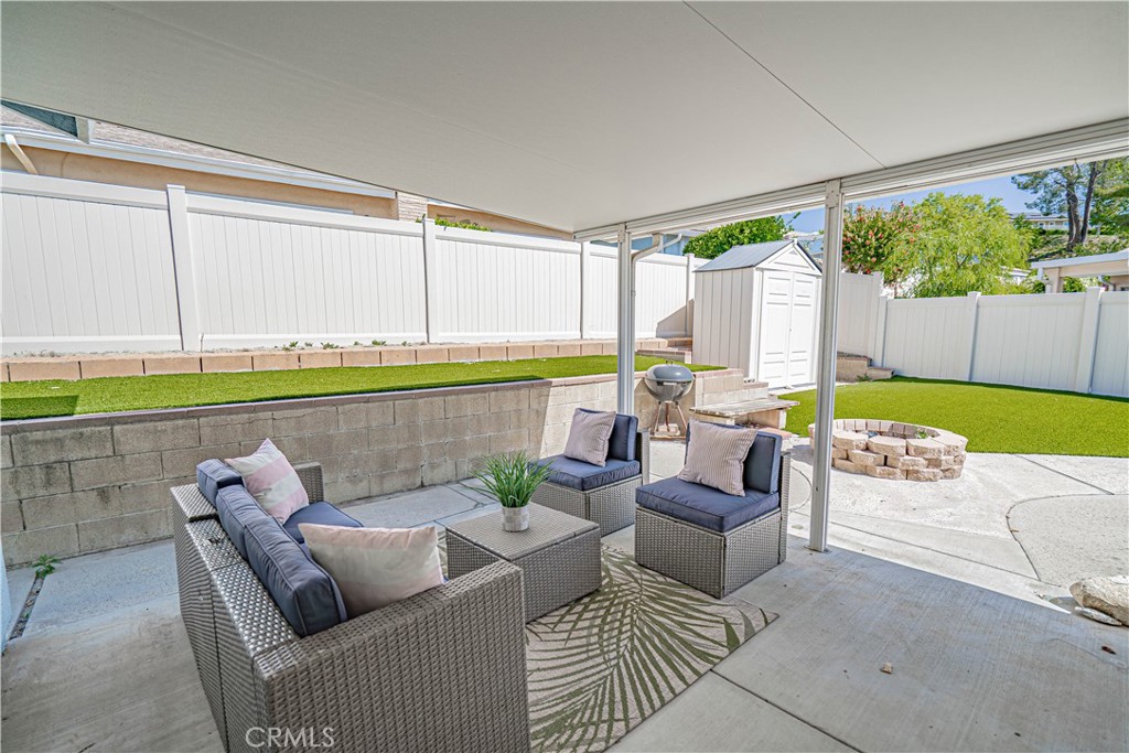 26478 Fairway Circle Newhall, CA 91321 - Photo 25 of 60 a living room with furniture and a large window