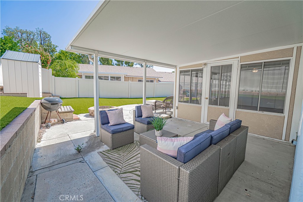 26478 Fairway Circle Newhall, CA 91321 - Photo 26 of 60 a outdoor space with patio the couches and a dining table with garden view