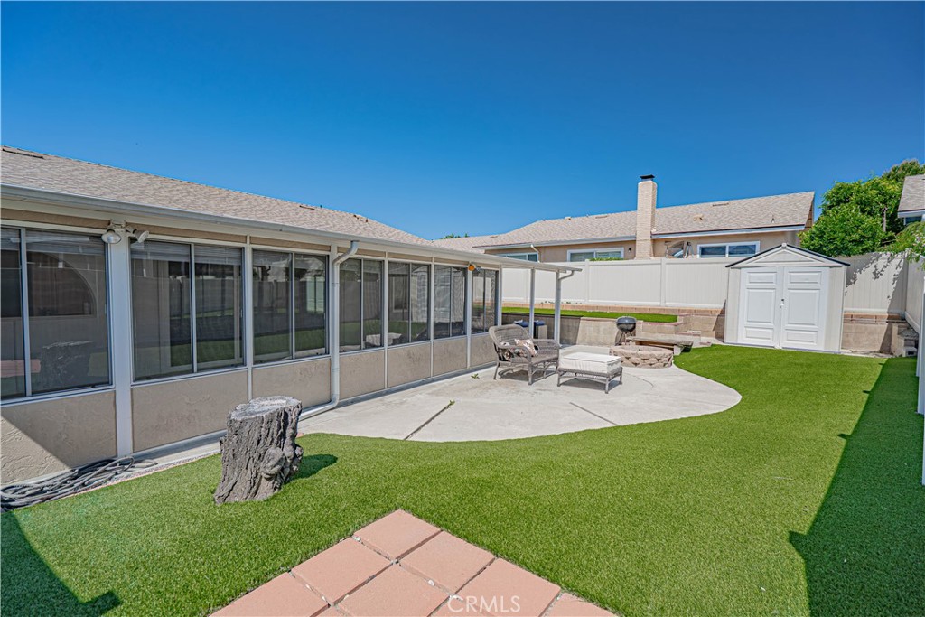 26478 Fairway Circle Newhall, CA 91321 - Photo 29 of 60 a view of a house with backyard sitting area and garden