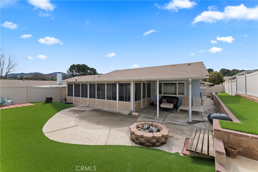 26478 Fairway Circle Newhall, CA 91321 - Photo 30 of 60 a balcony with furniture and a garden