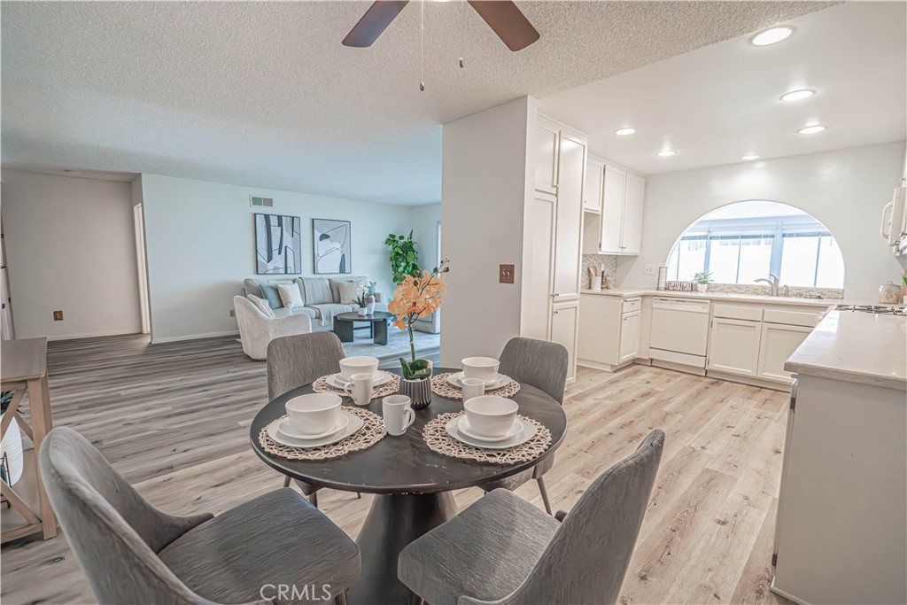 26478 Fairway Circle Newhall, CA 91321 - Photo 5 of 60 a view of a dining room with furniture and wooden floor