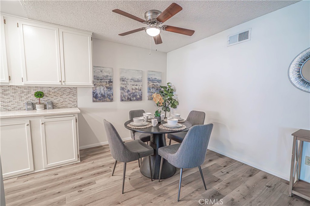 26478 Fairway Circle Newhall, CA 91321 - Photo 7 of 60 a view of a dining room with furniture window and wooden floor