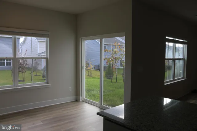 a kitchen with granite countertop a stove and a sink