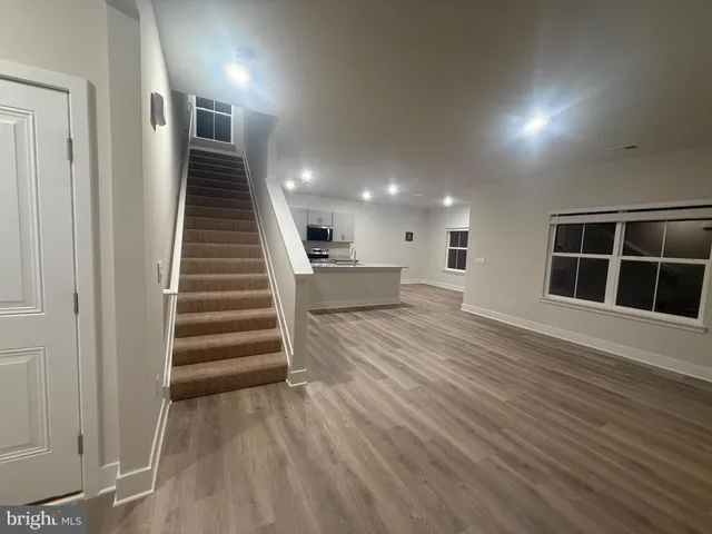 a view of a hallway with a refrigerator