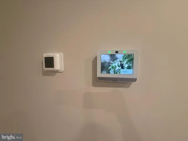 a view of a hallway with wooden floor and closet