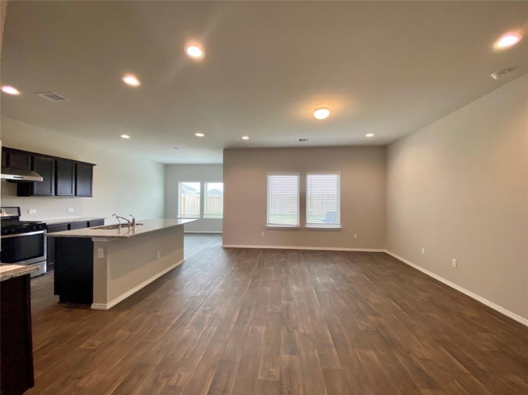 2330 Georgina Falls Drive Spring, TX 77373 - Photo 3 of 12 a large space with a large kitchen counter top and stainless steel appliances
