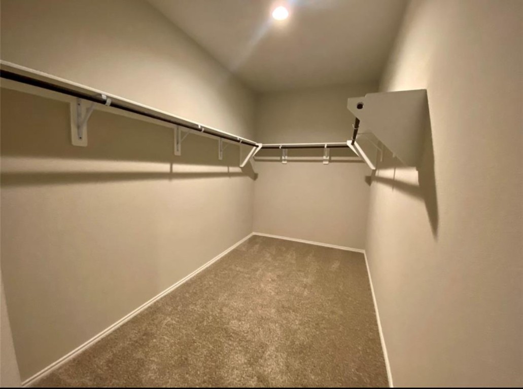 2330 Georgina Falls Drive Spring, TX 77373 - Photo 6 of 12 a view of a room with racks on the wall