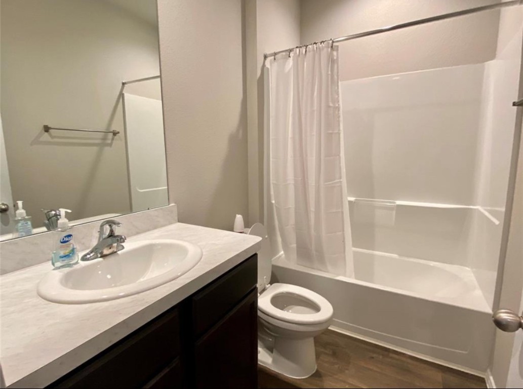 2330 Georgina Falls Drive Spring, TX 77373 - Photo 7 of 12 a bathroom with a sink a toilet and shower
