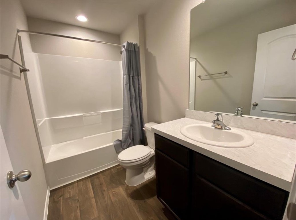 2330 Georgina Falls Drive Spring, TX 77373 - Photo 10 of 12 a bathroom with a sink toilet a mirror and shower