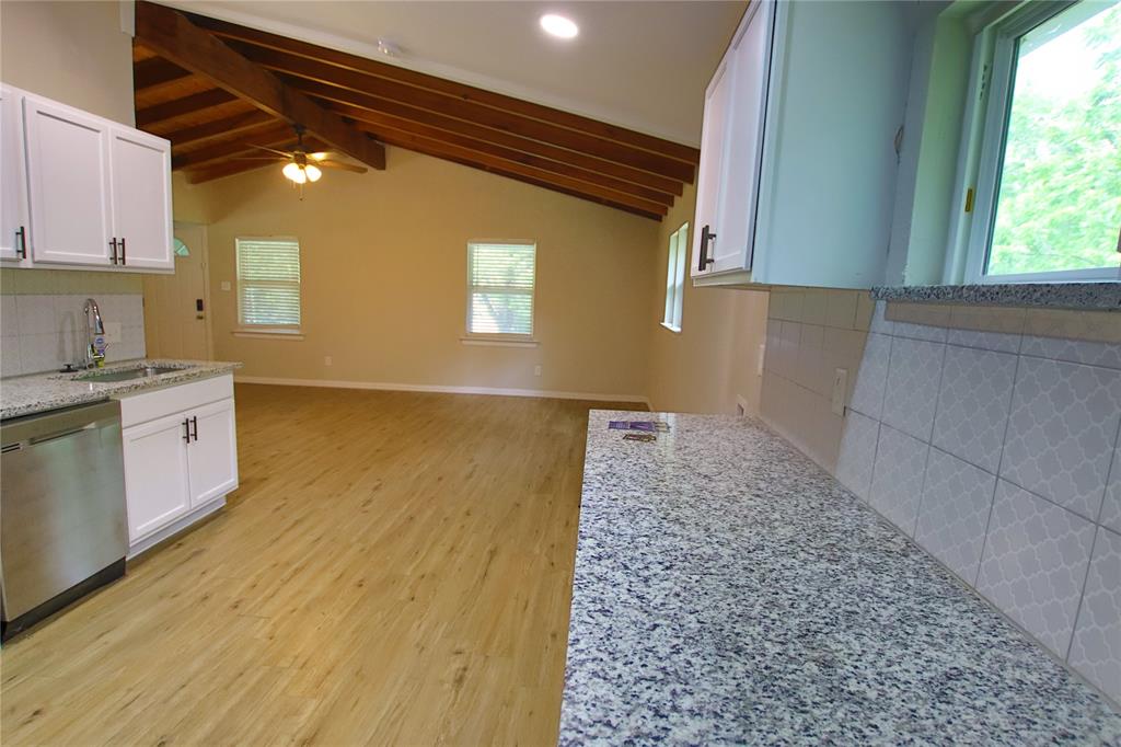 142 Andrea Street, Unit B Pottsboro, TX 75076 - Photo 11 of 22 a view of a kitchen with a sink and cabinets