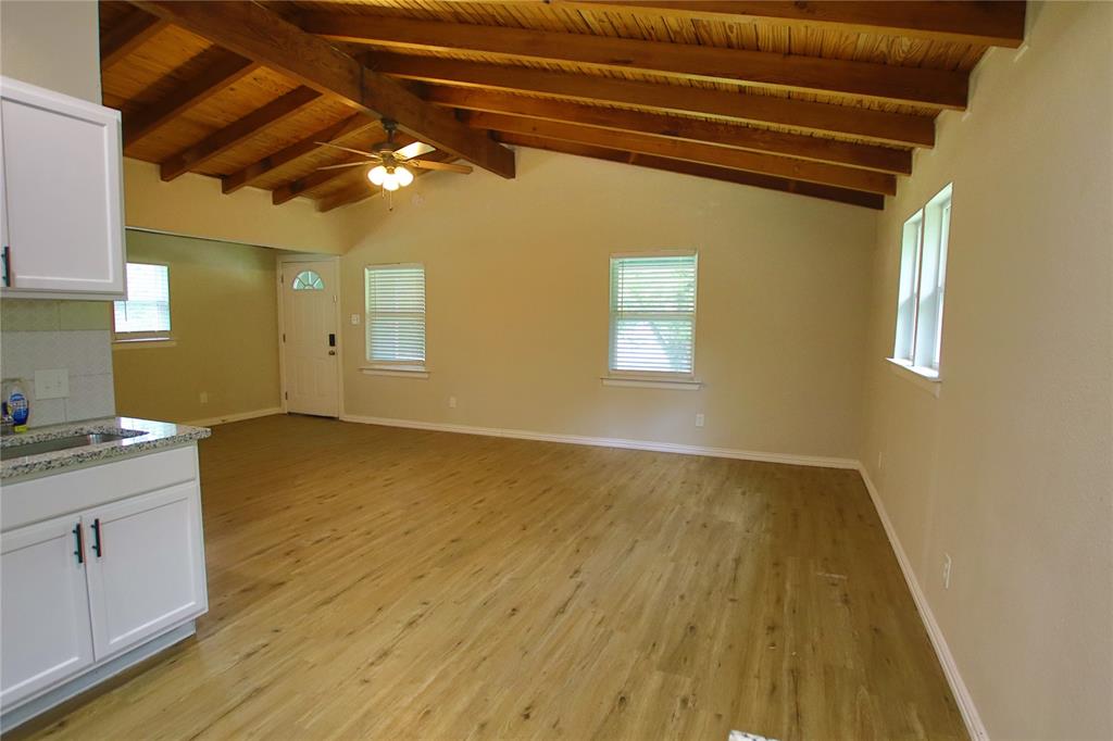 142 Andrea Street, Unit B Pottsboro, TX 75076 - Photo 12 of 22 a view of a livingroom with wooden floor