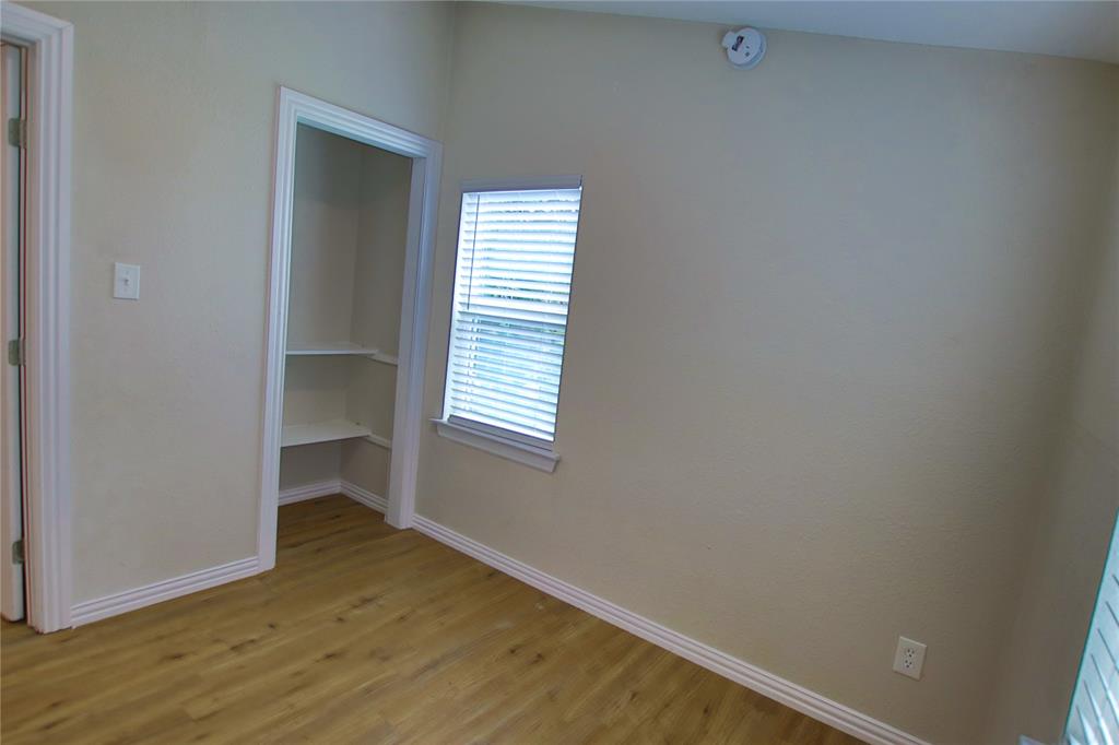 142 Andrea Street, Unit B Pottsboro, TX 75076 - Photo 14 of 22 a view of a room that has a window in it