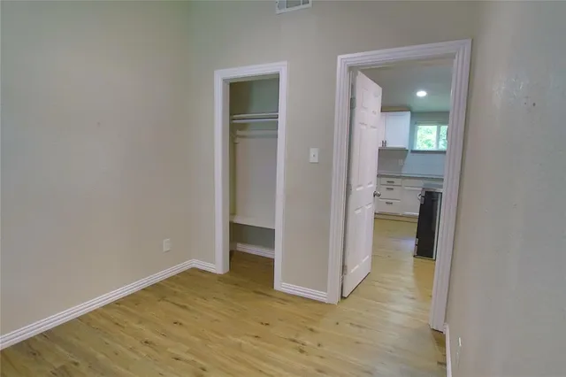 wooden floor in a kitchen and a room