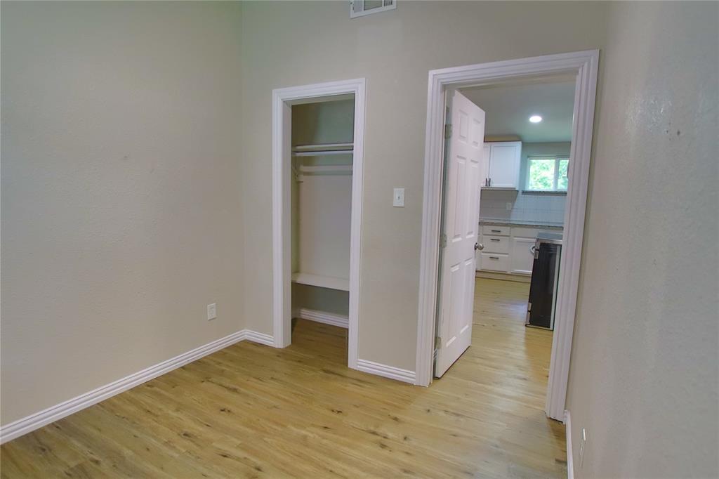 142 Andrea Street, Unit B Pottsboro, TX 75076 - Photo 16 of 22 wooden floor in a kitchen and a room