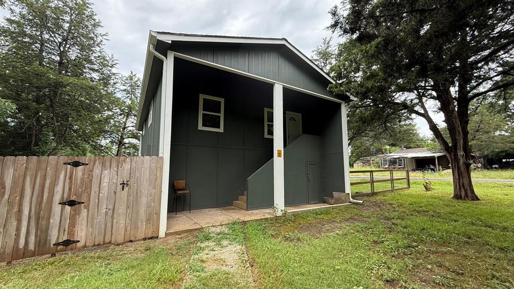 142 Andrea Street, Unit B Pottsboro, TX 75076 - Photo 21 of 22 a view of front of a house with a yard