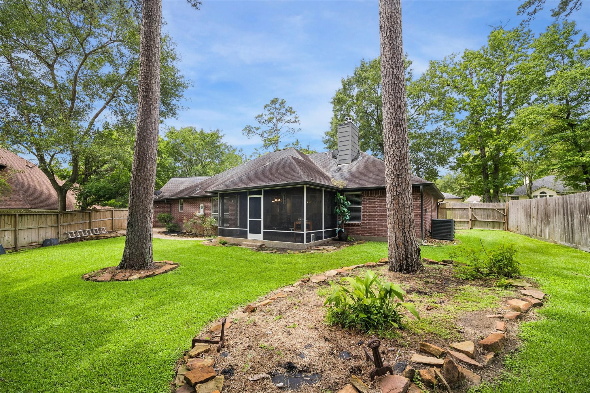 109 Dawns Edge Conroe, TX 77356 - Photo 22 of 24 a front view of a house with garden