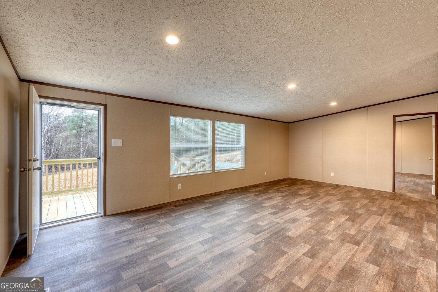 Tract B Kyle Road Blue Ridge, GA 30513 - Photo 13 of 37 a view of an empty room with wooden floor and a window