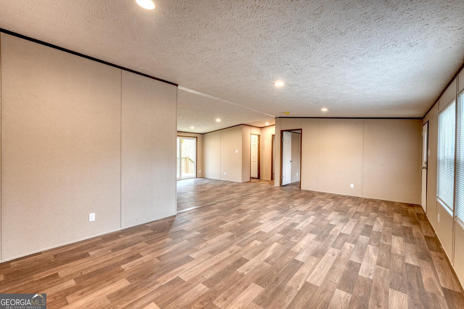 Tract B Kyle Road Blue Ridge, GA 30513 - Photo 15 of 37 a view of an empty room with wooden floor and a window