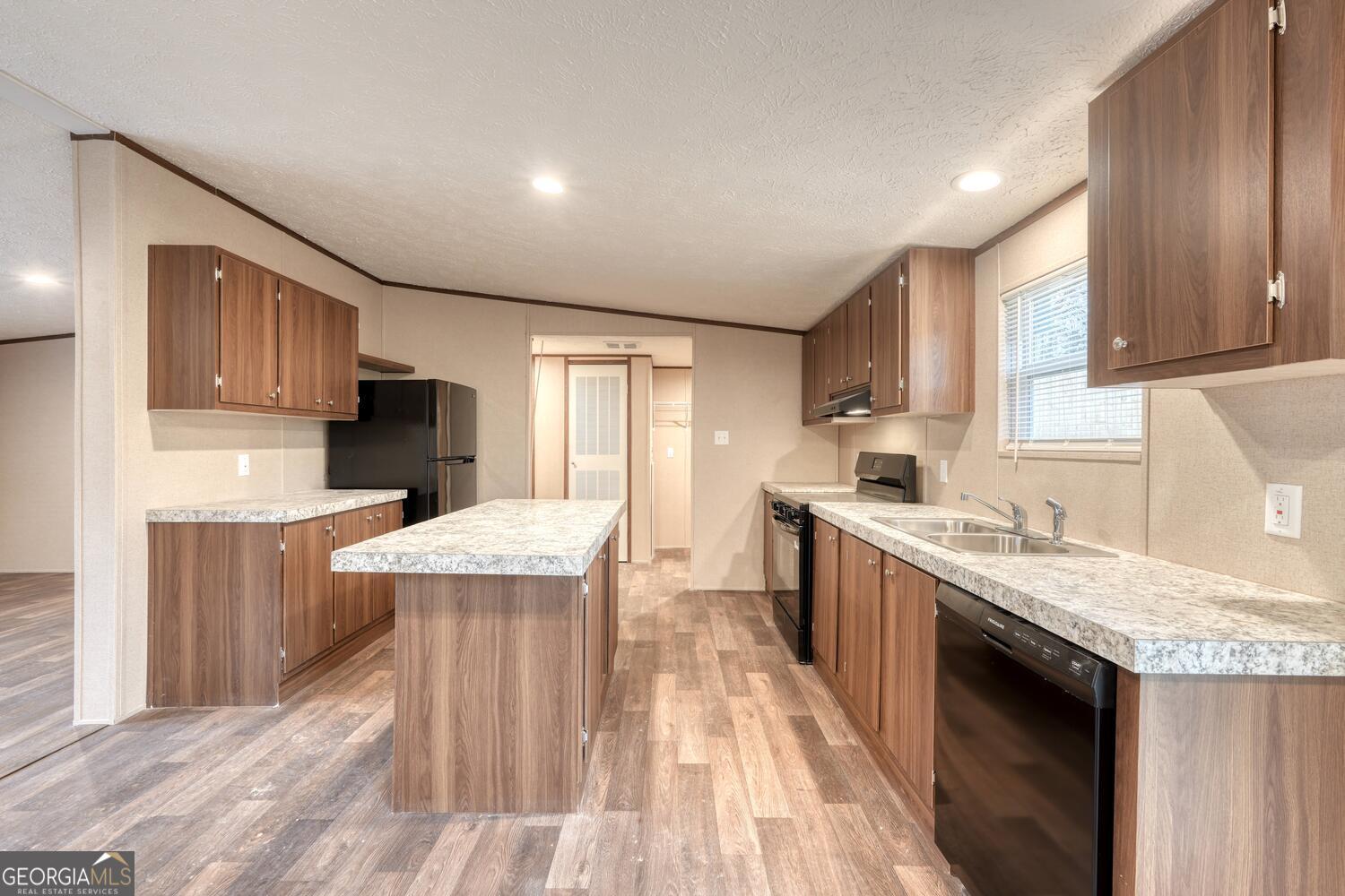 Tract B Kyle Road Blue Ridge, GA 30513 - Photo 18 of 37 a kitchen with a sink a counter top space stainless steel appliances and cabinets