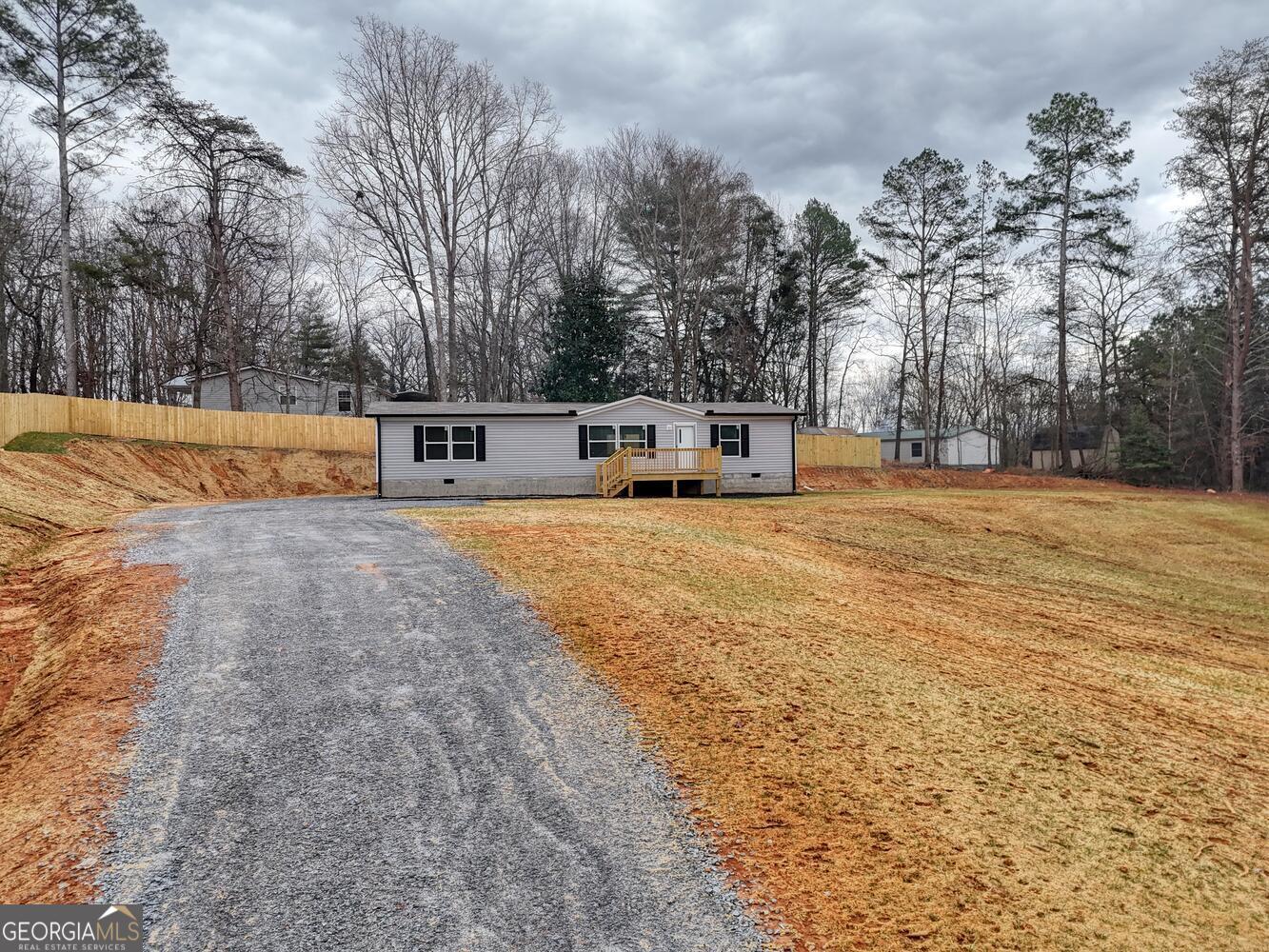Tract B Kyle Road Blue Ridge, GA 30513 - Photo 2 of 37 a view of a house with swimming pool and trees in the background