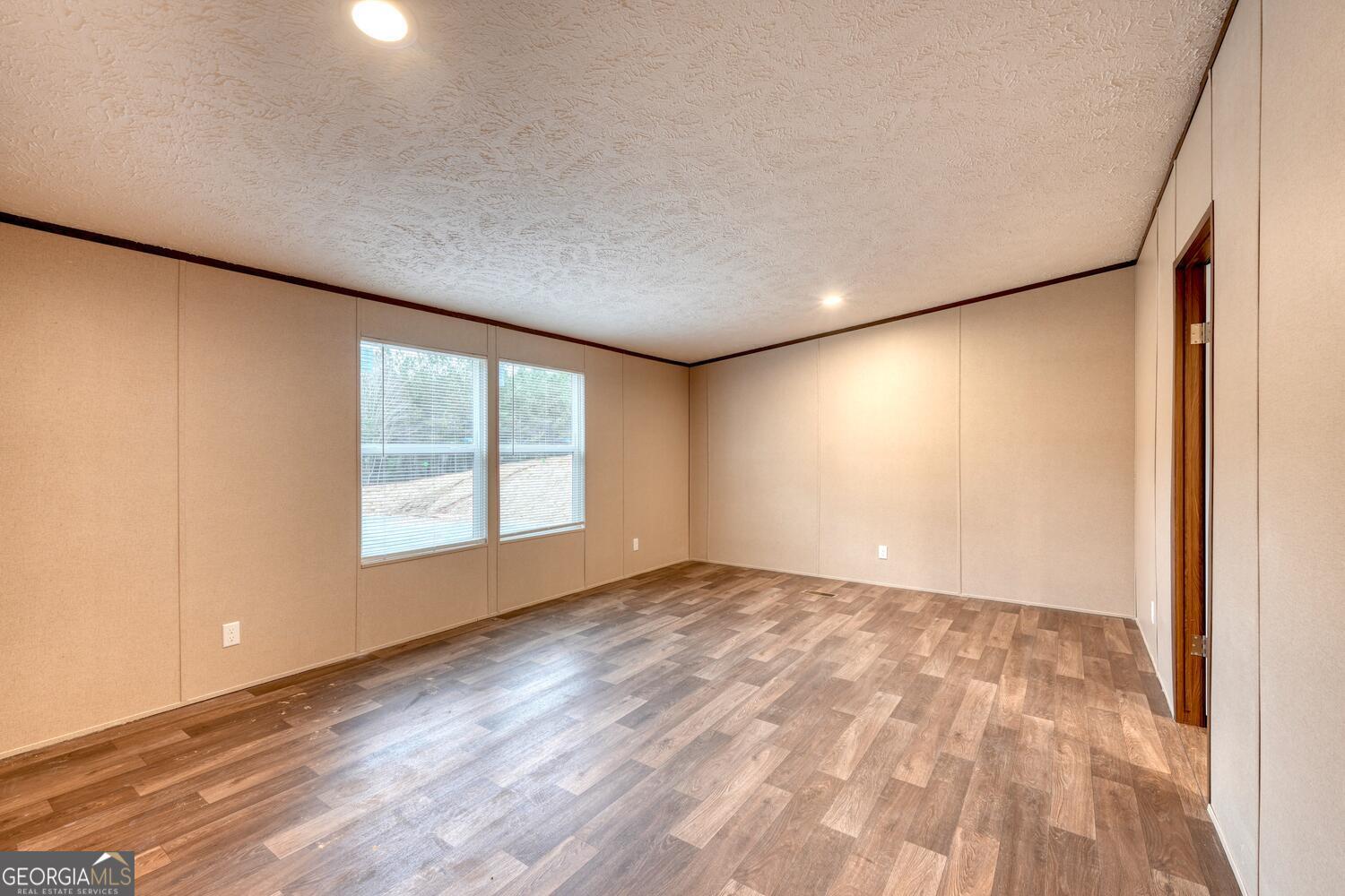 Tract B Kyle Road Blue Ridge, GA 30513 - Photo 23 of 37 a view of an empty room with a window and wooden floor