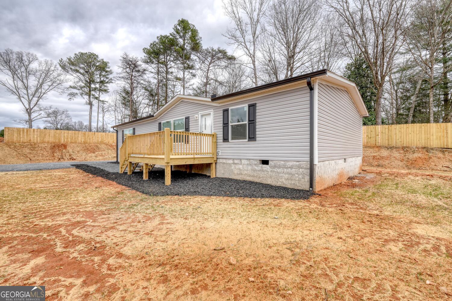 Tract B Kyle Road Blue Ridge, GA 30513 - Photo 4 of 37 a view of a house with a yard covered in snow