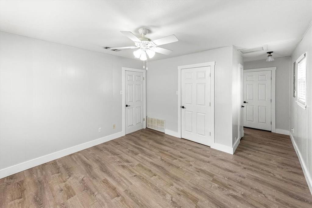 334 County Road 1296 Morgan, TX 76671 - Photo 12 of 32 a view of an empty room with wooden floor