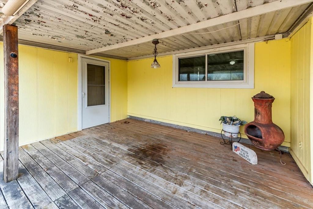 334 County Road 1296 Morgan, TX 76671 - Photo 16 of 32 a view of a room with wooden floor and furniture