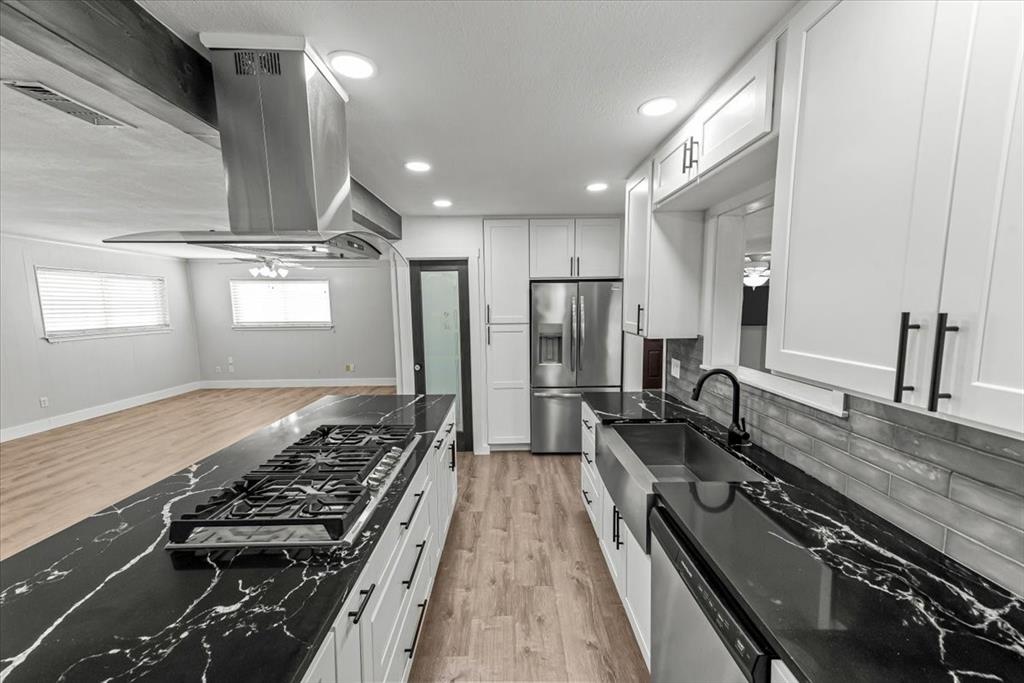 334 County Road 1296 Morgan, TX 76671 - Photo 7 of 32 a kitchen with sink stove and refrigerator