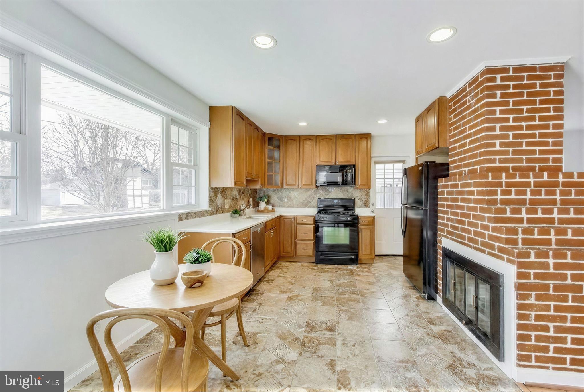 7402 Inzer Street Springfield, VA 22151 - Photo 6 of 49 Virtually Staged Eat-In Kitchen has Gas Cooking