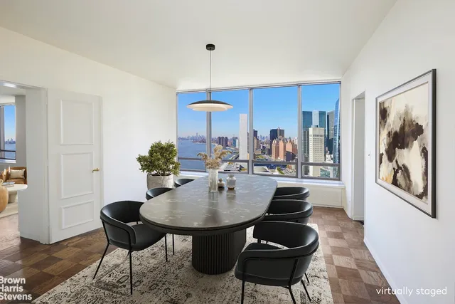 a view of kitchen with furniture and refrigerator