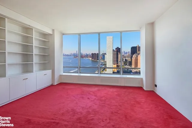 a bathroom with a granite countertop sink mirror and shower