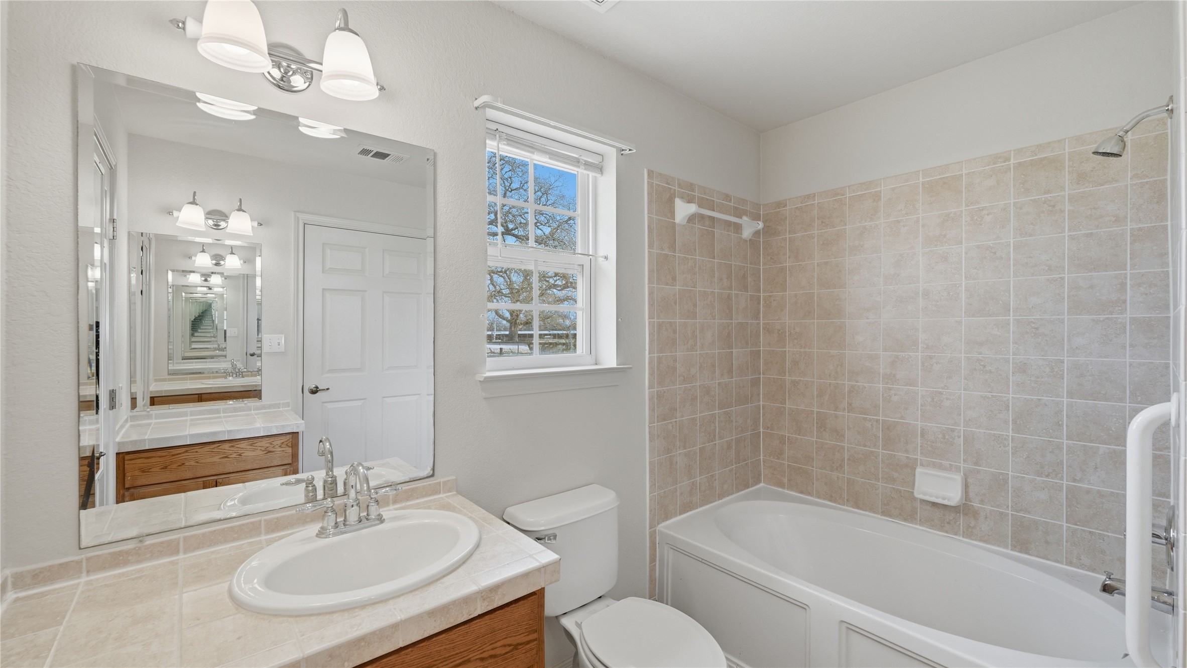 369 Young School House Road Smithville, TX 78957 - Photo 14 of 30 Full bath with vanity and bathtub / shower combination