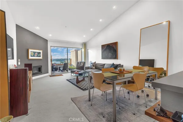 a view of a livingroom with workspace and a couch