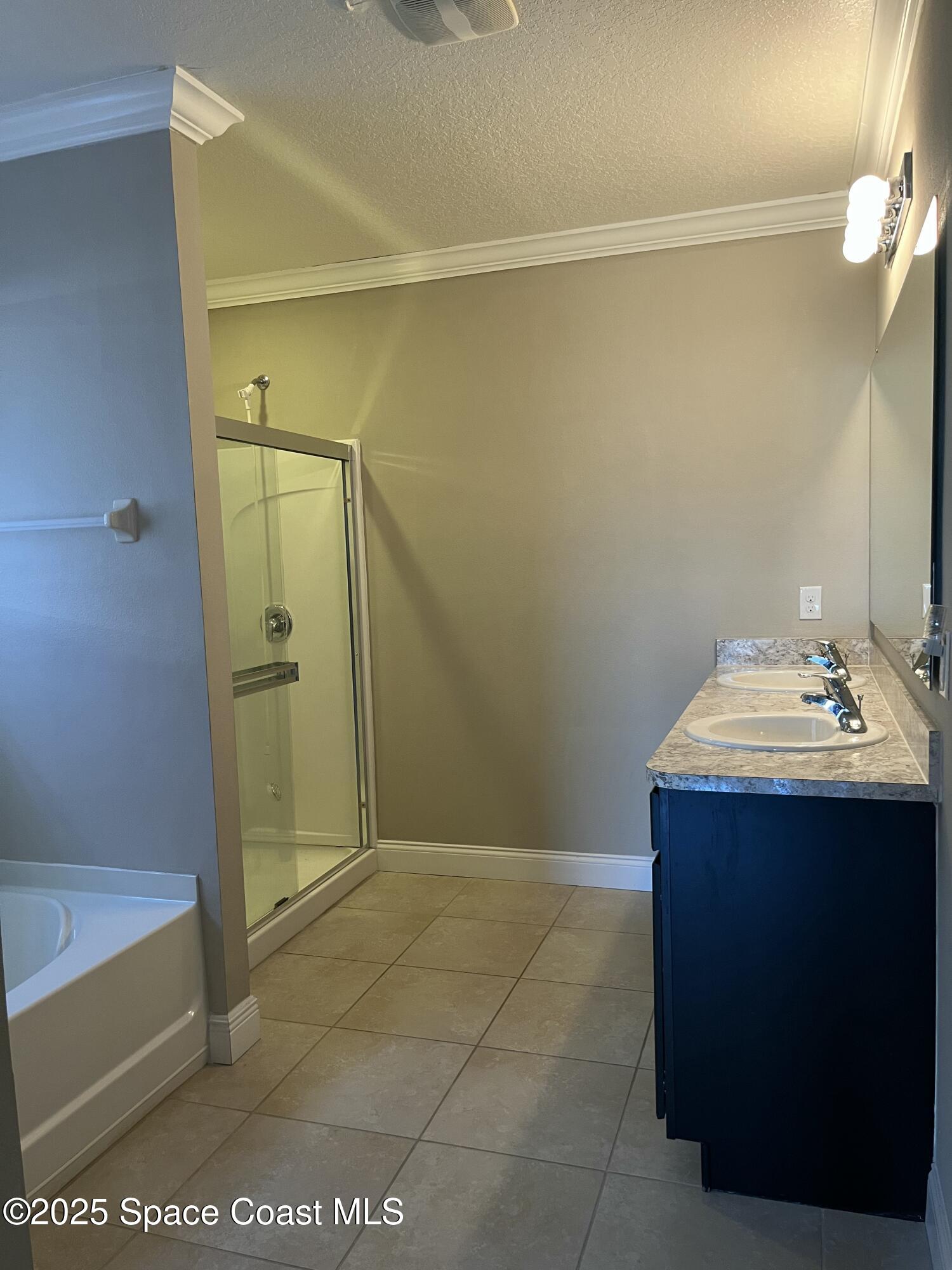 2209 McCormack Way Melbourne, FL 32935 - Photo 14 of 22 a bathroom with a sink and shower